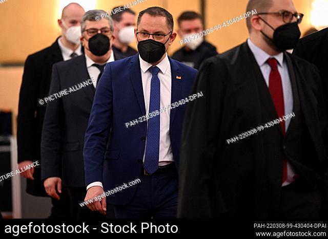 08 March 2022, North Rhine-Westphalia, Cologne: Tino Chrupalla, chairman of the AfD, arrives in the courtroom before the start of the trial