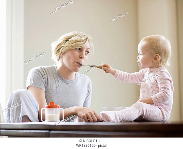 mother and baby girl at the breakfast table