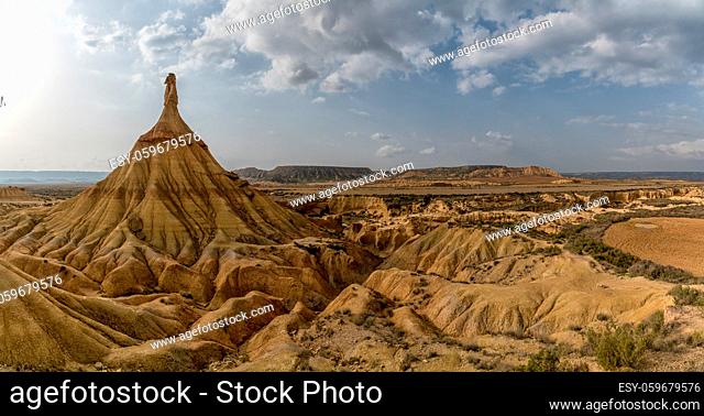 A panorama view of the Castildetierra cliff and desert grasslands in the Bardenas Reales desert in northern Spain
