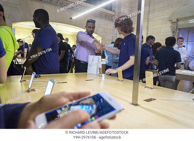 A customer in the Apple store in Grand Central Terminal in New York after buying a new iPhone 8 on Friday, September 22, 2017, the first day it went on sale