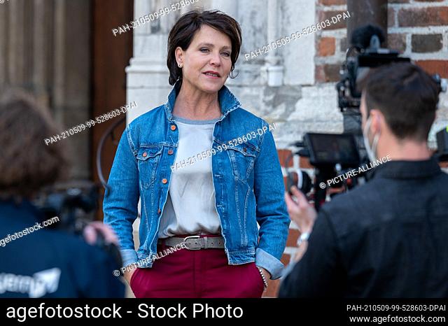 08 May 2021, Bavaria, Landshut: Janina Hartwig, actress, stands in front of the camera during a filming session for a digital city walk