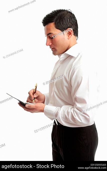 A businessman or waiter wriring in a notebook or taking an order. White background