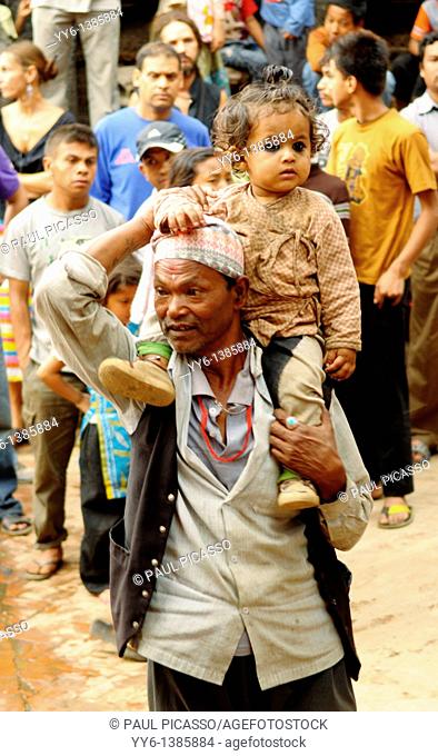little nepalis girl with her father , the nepalis , life in kathmandu , kathmandu street life , nepal