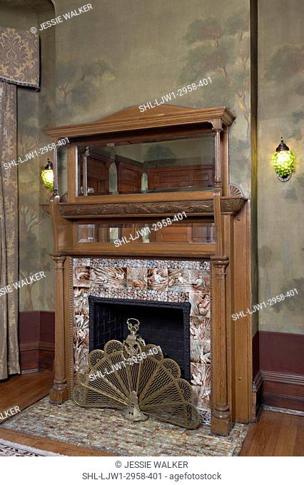 FIREPLACES: Arts And Crafts home, antique fireplace with built in mirrors, tile surround and hearth, brass fan fireplace screen, painted walls
