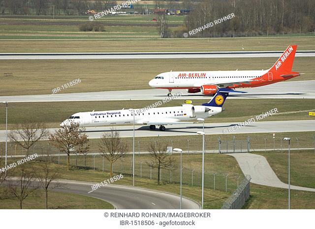 An Air Berlin Airbus A 320 plane and a Lufthansa short distance jet, Munich Franz Josef Strauss Airport, Munich, Bavaria, Germany, Europe