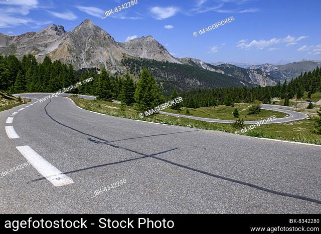 Panoramic view of winding alpine road Mountain road in front of Col de l Izoard, Cottian Alps, Route des Grandes Alpes, Hautes-Alpes department, France, Europe