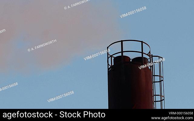 Stockholm, Sweden Steam coming out of a smokestack in an industrial area