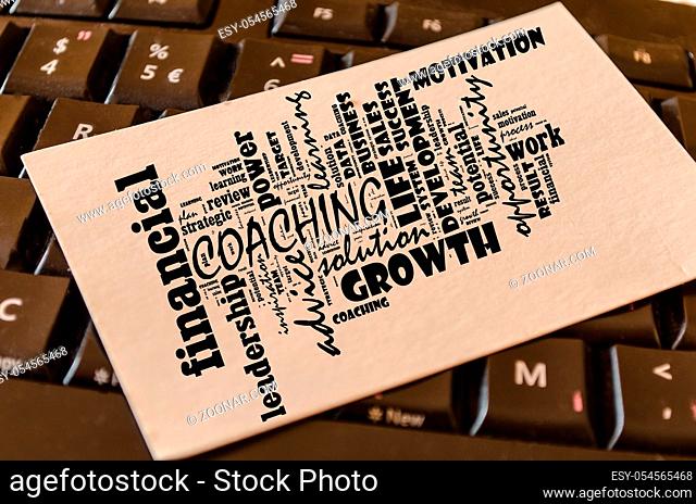 Coaching word cloud collage over keyboard background