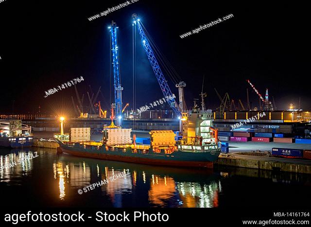 container ship is loaded, rostock overseas port, warnemünde, mecklenburg-western pomerania, germany