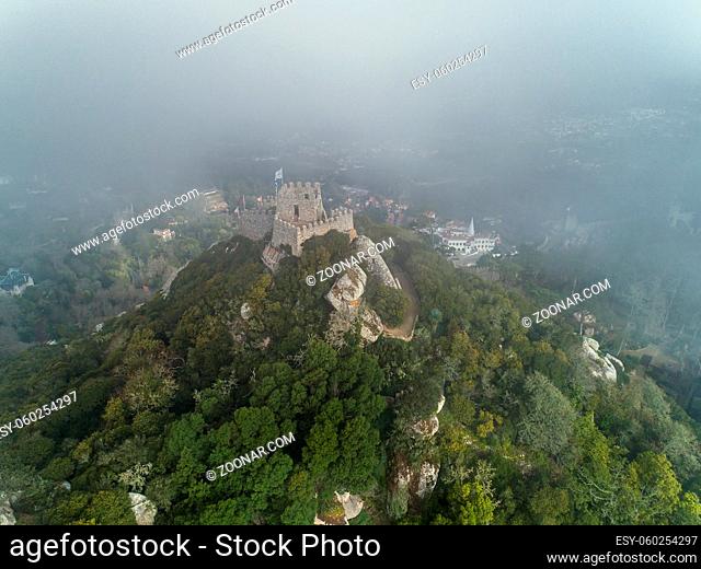 Aerial view of Castelo dos Mouros or Moorish Castle in fog, Sintra, Portugal
