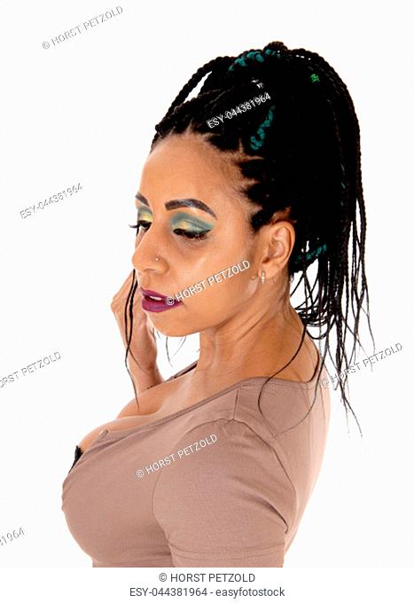 A close up portrait of a woman with her nice braided black.long hair in profile, isolated for white background