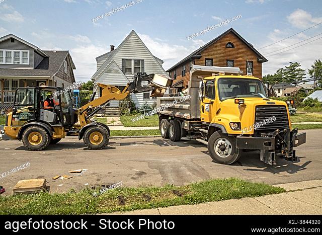 Detroit, Michigan - Seven inches of rain caused severe flooding in many Detroit neighborhoods. A week later, city workers were picking up soggy belongings...
