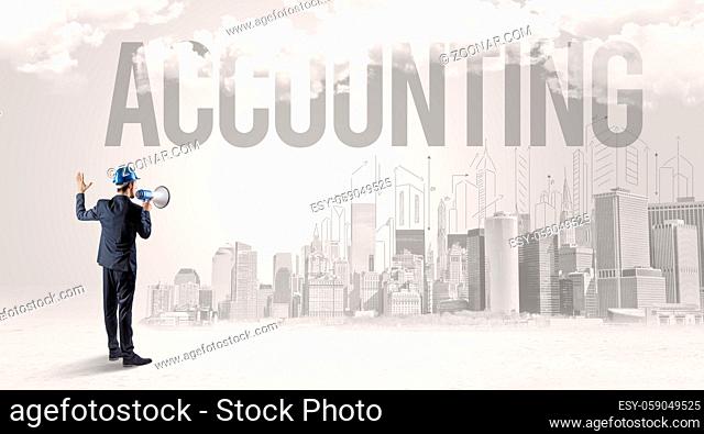 Young businessman with hard hat and ACCOUNTING inscription, new business opportunity concept
