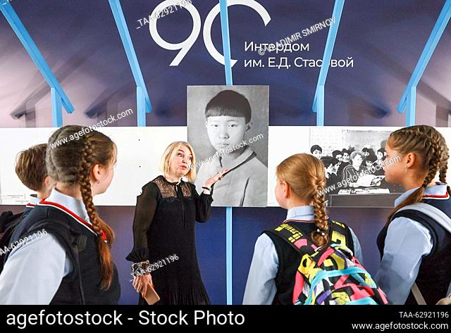 RUSSIA, IVANOVO - OCTOBER 2, 2023: The school's deputy director Anna Gradova and students are seen by a portrait of Mao Anying, son of Mao Zedong
