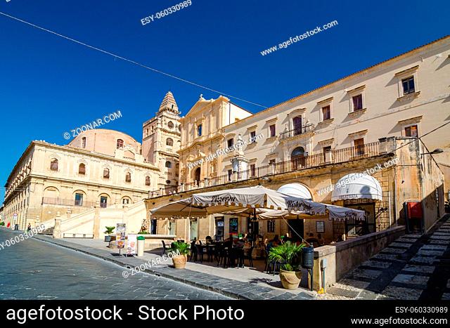 Noto, Italy - September 14, 2015: Pizzeria and view of the Church of Saint Francis Immaculate in the Noto, Italy