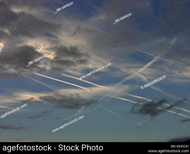 Condensation trails in the sky from jets, aircraft