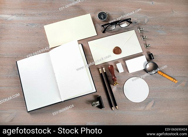 Retro stationery template on wood table background. Responsive design mock up