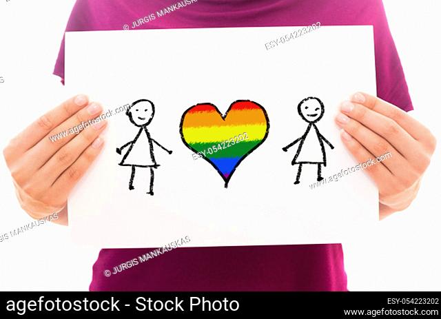 Girl holding white paper sheet with symbols: Two lesbians and heart