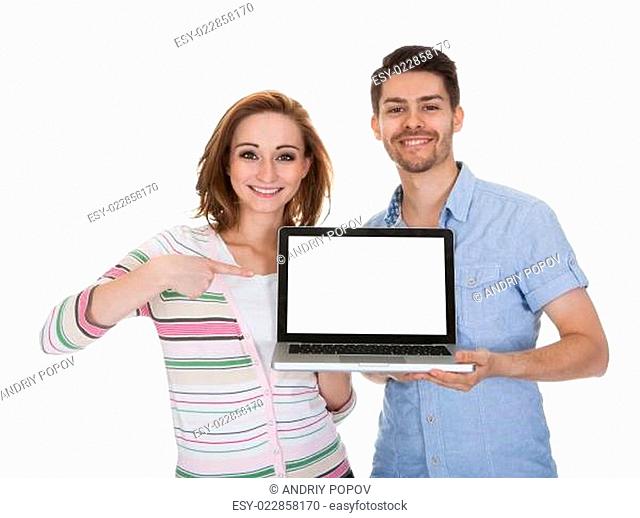 Young Couple Holding Laptop