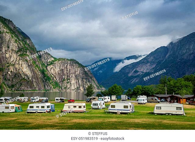 Nice camping at the fjord of Norway with beautiful mountain background. Eidfjord, Hordaland, Norway