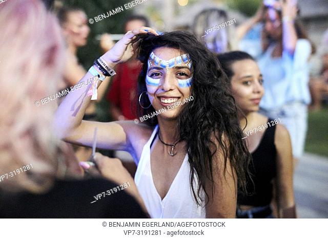 woman with face paint, at Tribal Beach Party at Starbeach Chersonissos, Crete, Greece, on 31. July 2018
