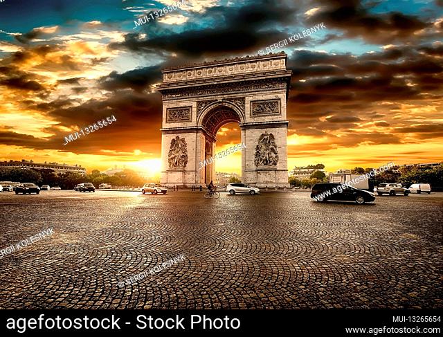 Beautiful cloudy sunset over Arc de Triomphe in Paris, France