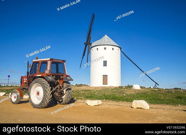 Tractor and windmill. Campo de Criptana, Ciudad Real province, Castilla La Mancha, Spain