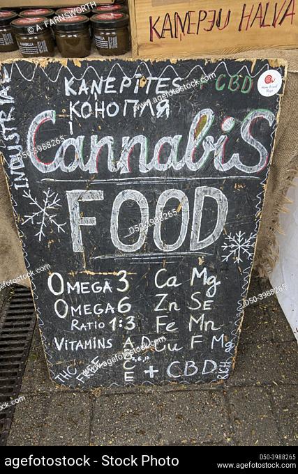 Riga, Latvia, A sign selling cannabis and cbd oil infused food and supplements at an outdoor market