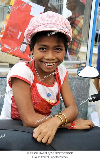 Young Cambodian Girl with funky Cab Smiling