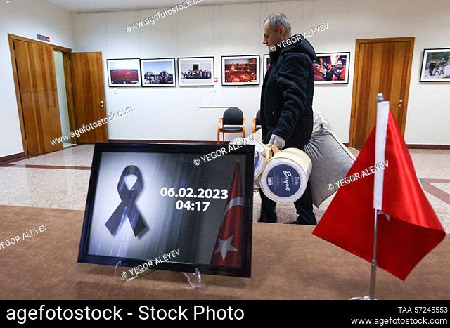 RUSSIA, KAZAN - FEBRUARY 8, 2023: A man carries packages of humanitarian aid collected for earthquake victims at the Turkish Consulate General in Kazan