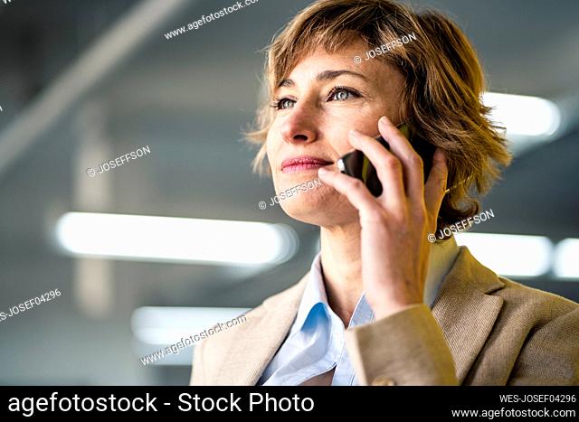 Mature businesswoman talking on mobile phone