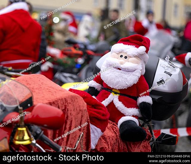 10 December 2022, Berlin: A plush Santa Claus sits on a Christmas-decorated motorcycle during the ""Santa Claus on Road"" campaign