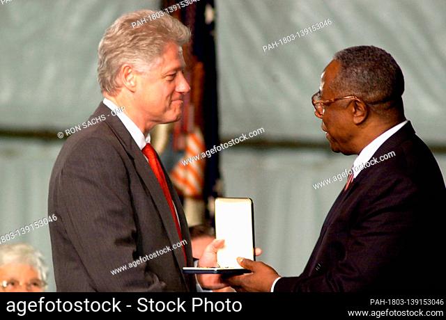 Baseball great Henry ""Hank"" Aaron receives the Presidential Citizens Medal from United States President Bill Clinton at the White House in Washington