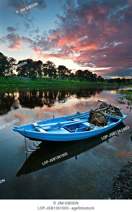 A salmon fishing boat at Canny Fishery in Norham. These traditional boats or cobles are used to catch salmon in the River Tweed using a traditional method of...