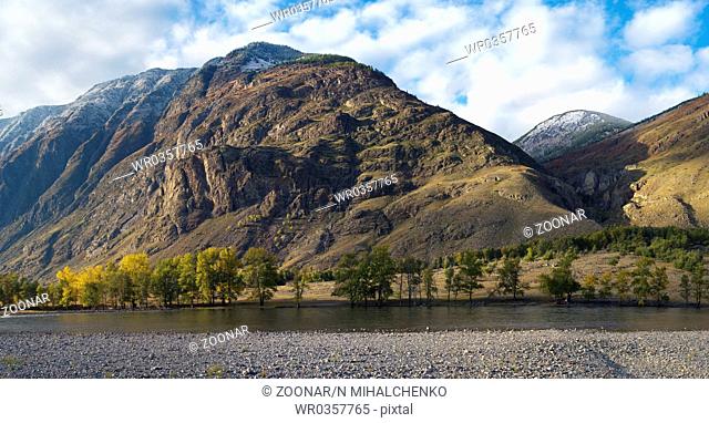 Panoramic mountain landscape with snowy peak and river