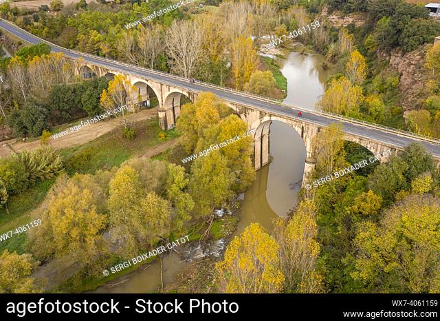 Aerial view of the Cal Forcada company town and the Llobregat river in NavÃ s during autumn (Bages, Barcelona, Catalonia, Spain)