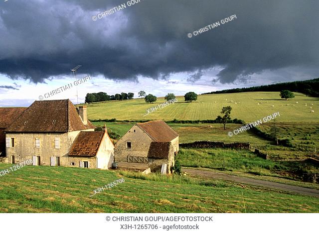 farmhouse under stormy sky, around Nevers, Nievre department, region of Burgundy, center of France, Europe