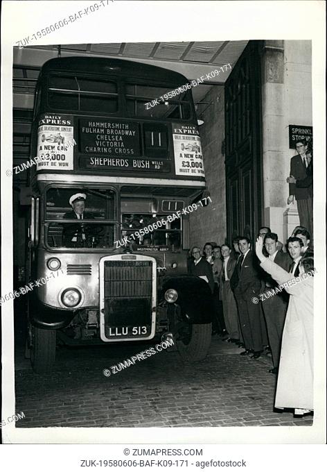 Jun. 06, 1958 - London Buses Back On The Road After Strike Photo Shows:- By-standers give a rousing send-off to this No. 11 bus as it drove out of Riverside...
