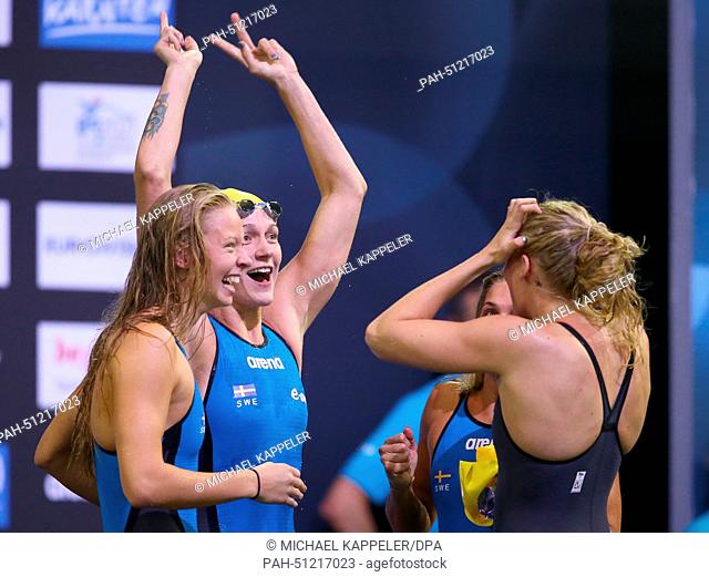 Michelle Coleman, Magdalena Kuras (2-R), Louise.Hansson (R) and Sarah Sjoestroem (L) of Sweden react after winning the Women's 4X100m Freestyle Final at the...