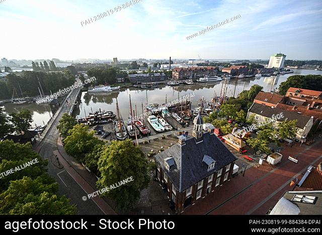 19 August 2023, Lower Saxony, Leer: View of the museum harbor, where numerous historic ships are moored in the harbor on the occasion of the event ""Treffen der...