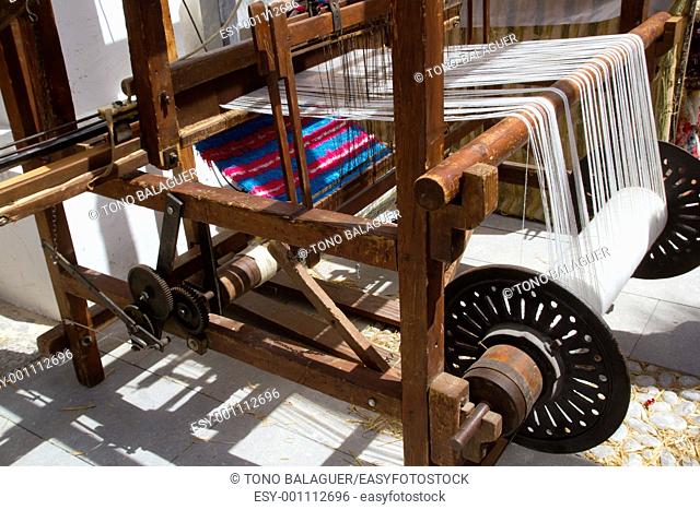 antique vintage spinner machine working in mediterranean fabric