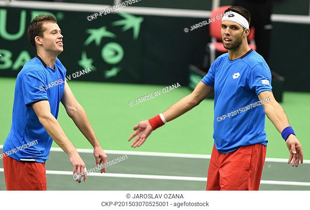 Adam Pavlasek (left), his partner Jiri Vesely celebrate as they won the Davis Cup World Group first round doubles tennis match against Samuel Groth and Lleyton...