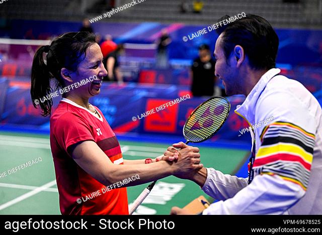 Badminton player Lianne Tan and Badminton Coach Indra Chandra celebrate after winning a match in the round of 16 of the women's singles competition badminton
