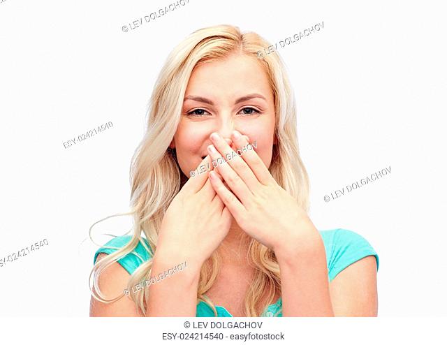 emotions, expressions, embarrassment and people concept - confused young woman or teenage girl wrinkling and closing her nose