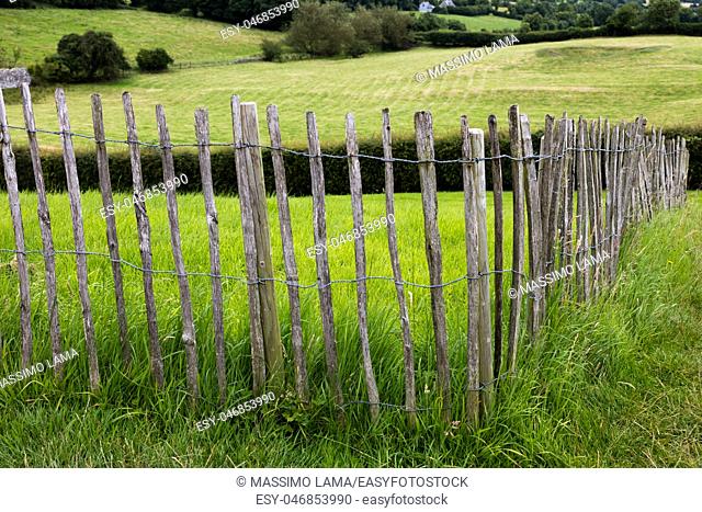 Wooden fence on a green backround in Nwgrange, Ireland