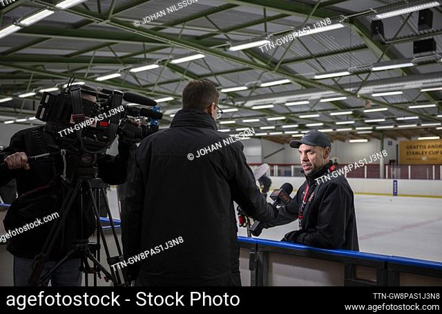 Alan Letang, the national team captain, is interviewed by Mark Masters, a reporter at TSN, when Canada's team trains in Limhamns Ice Hall in Malmö, Sweden