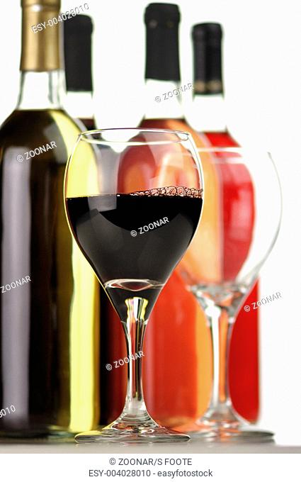 assortment of wine bottles and glasses