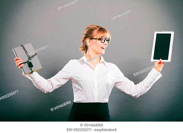 Businesswoman holding document and tablet. Choice between digital and physical data storage. Woman with padlock chained file and pc computer