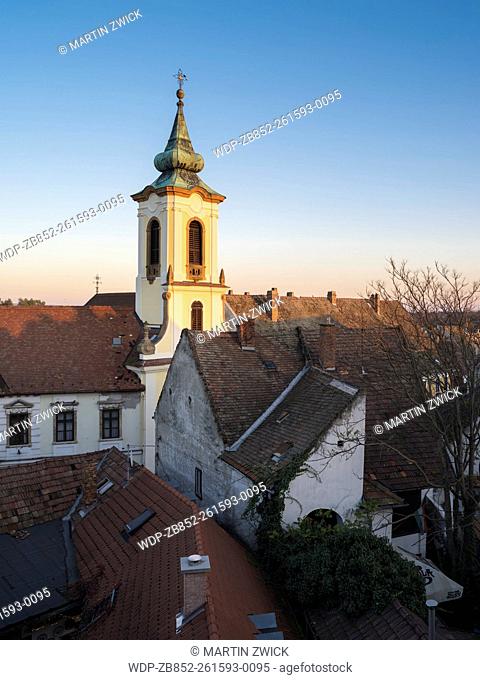 Szentendre near Budapest, a historic small town on the banks of the Danube. Sunset over the roofs of the old town with blagovescenska Church