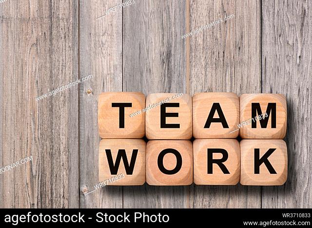 team work printed on wooden cubes